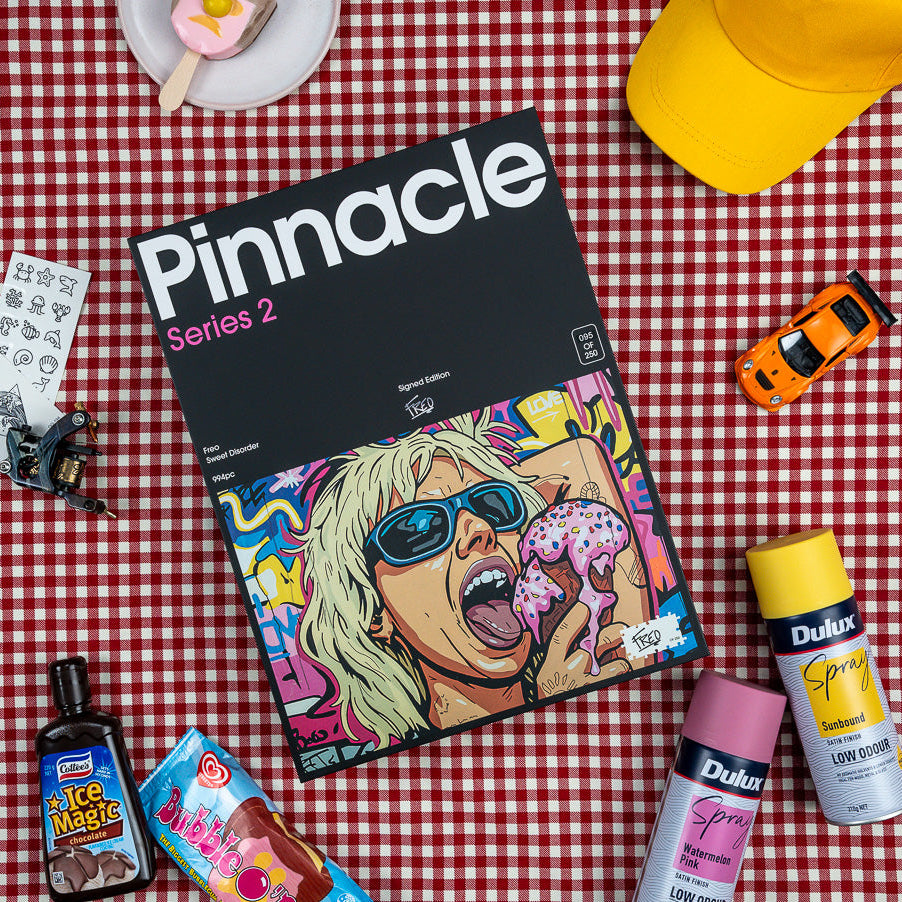 Sweet Disorder Pinnacle Puzzle Series 2 box by Freo shown in a colourful lifestyle flat lay